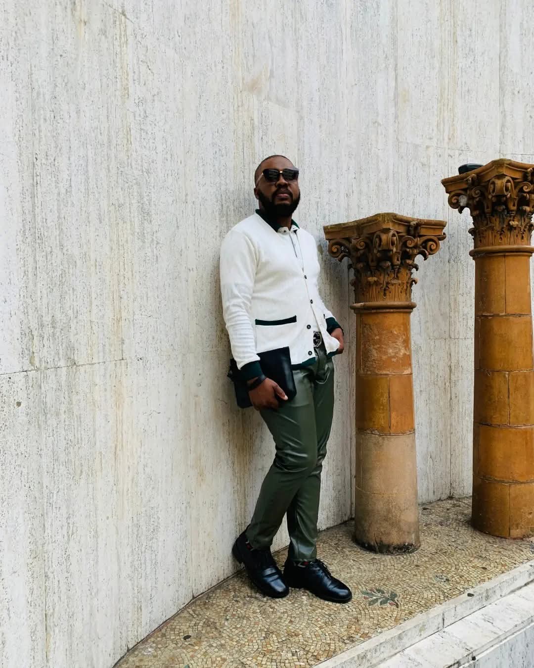 A second portrait of Mkhathini Mlotshwa in his white tailored jacket